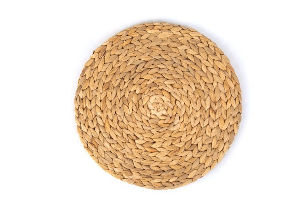 Round handwoven natural fibre coaster, geometric weave