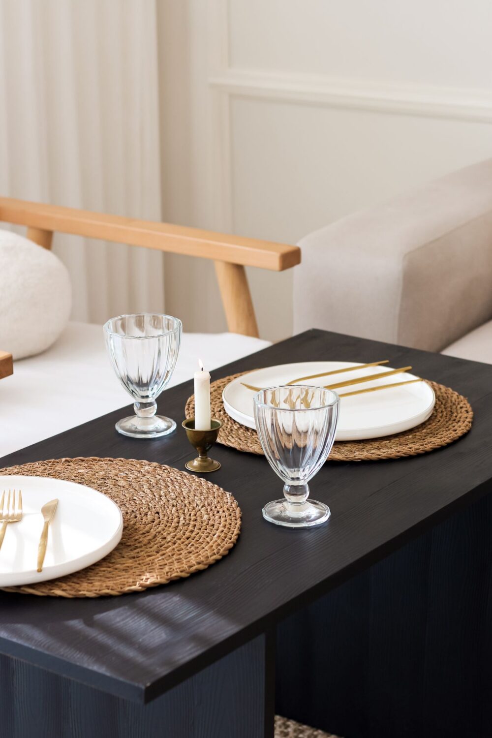 Woven placemats styled on a neutral dining table