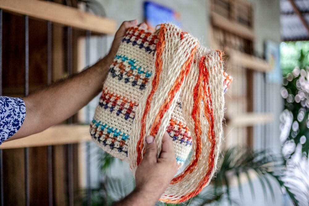 Handwoven Li brocade handbag with traditional geometric weave