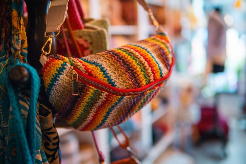 Colorful handwoven brocade shoulder bag on display