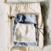 Set of handwoven drawstring pouches in natural tones