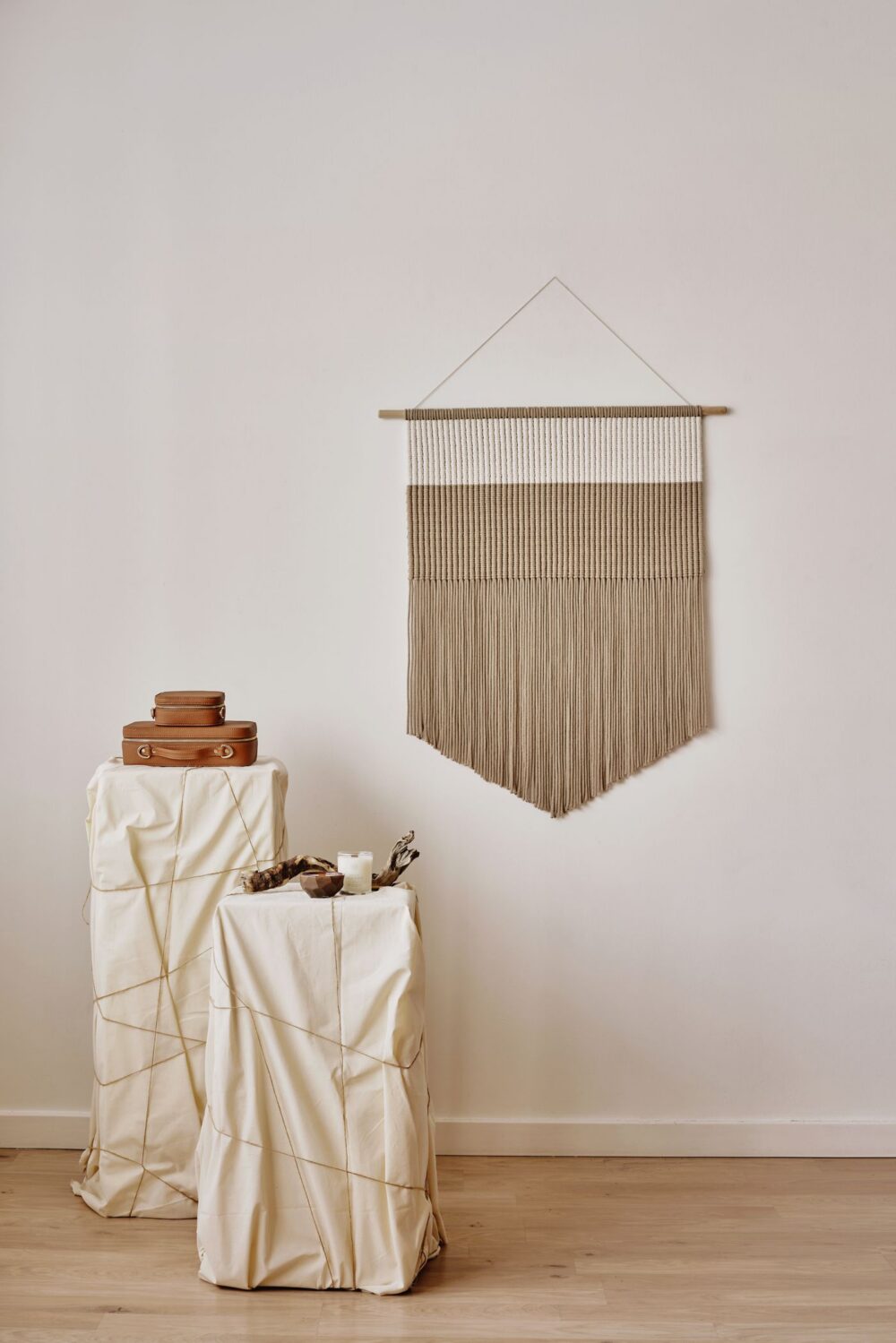 Minimal handwoven wall tapestry in natural undyed fibre