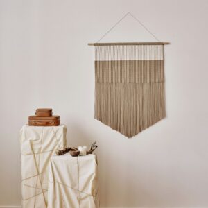 Minimal handwoven wall tapestry in natural undyed fibre